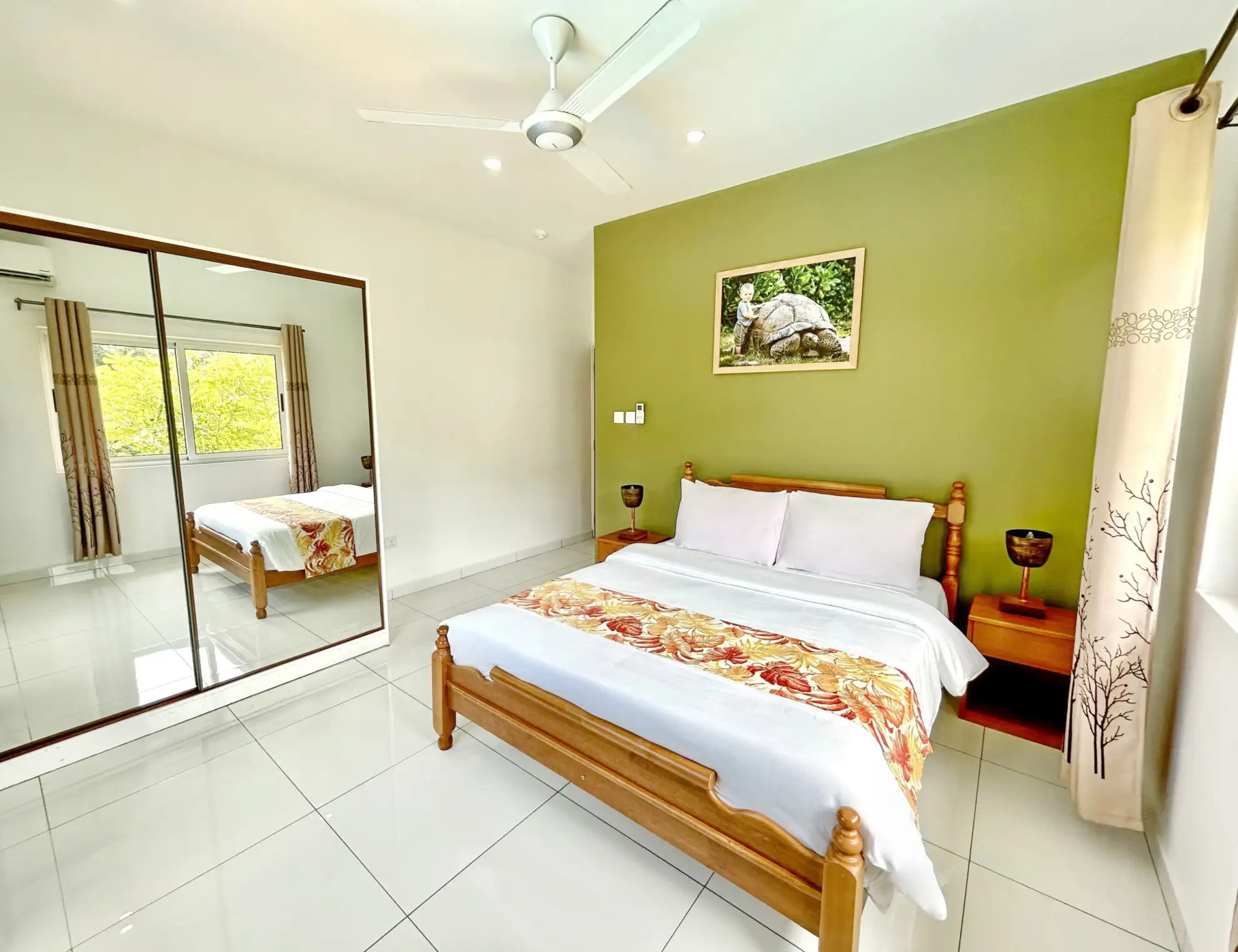 Escape to The Seaboards Apartments, nestled within a vibrant garden adorned with lush flowers and trees, on the breathtaking southwest of Mahe Island.