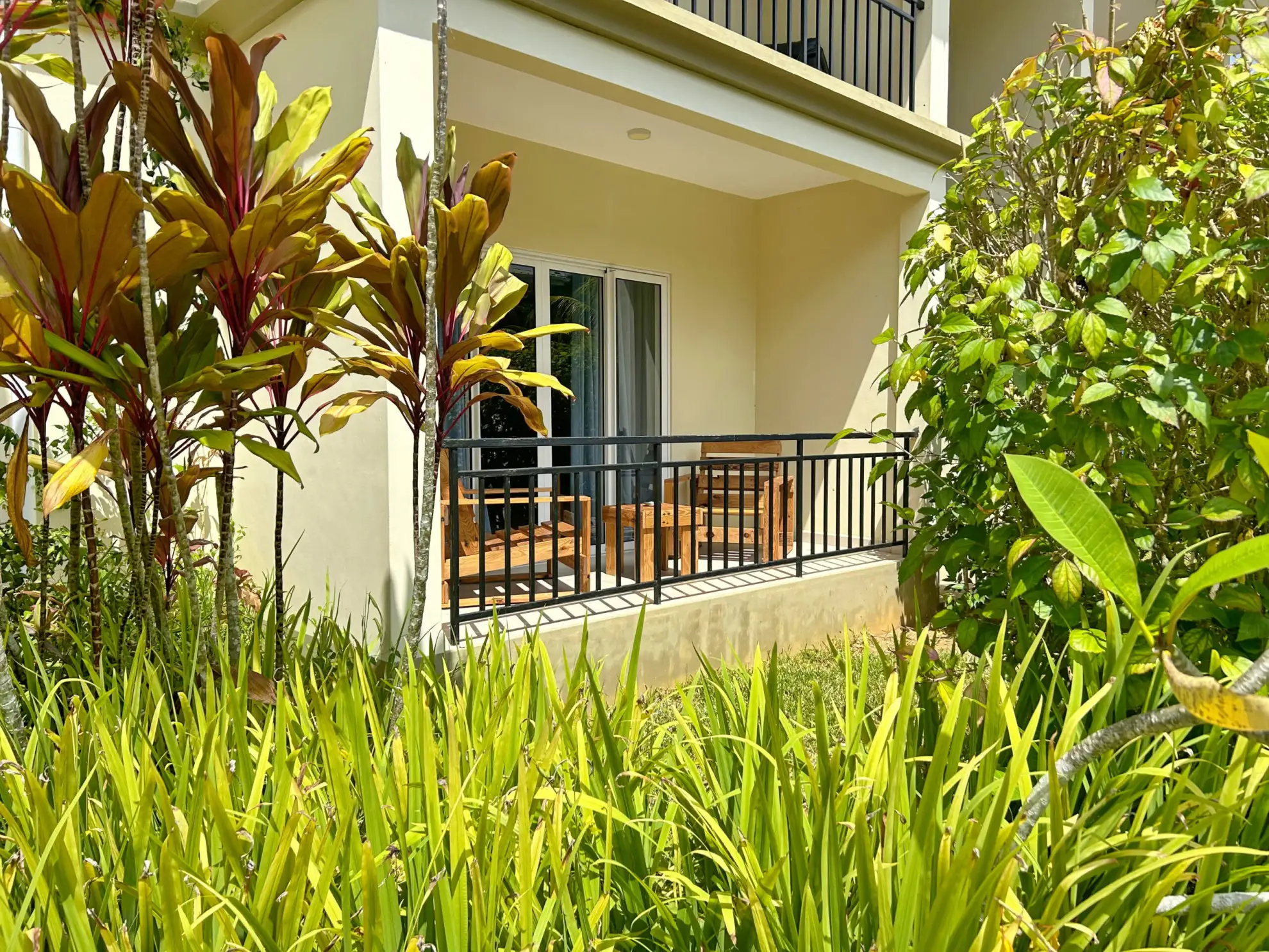 Escape to The Seaboards Apartments, nestled within a vibrant garden adorned with lush flowers and trees, on the breathtaking southwest of Mahe Island.