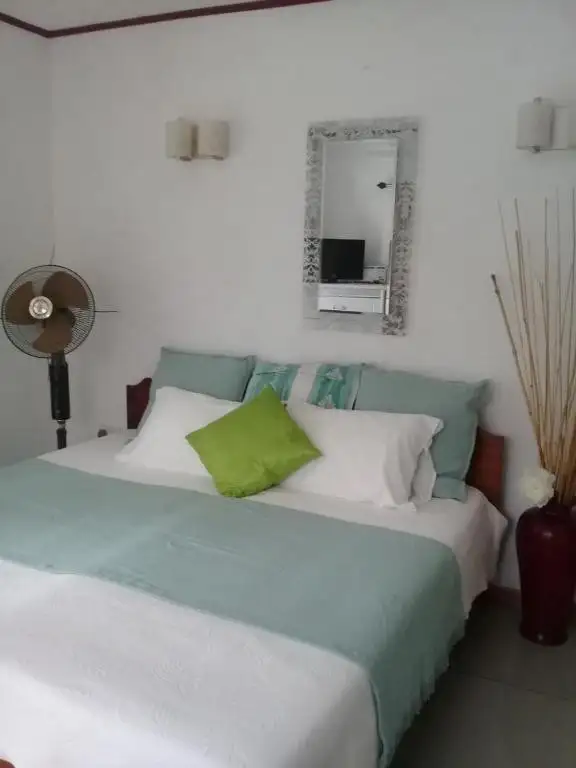 Indulge in a blissful getaway at Agnès Cottage: Where Elegance Meets Paradise, a picturesque family-run guesthouse mere moments away from the captivating La Source D'argent beach.