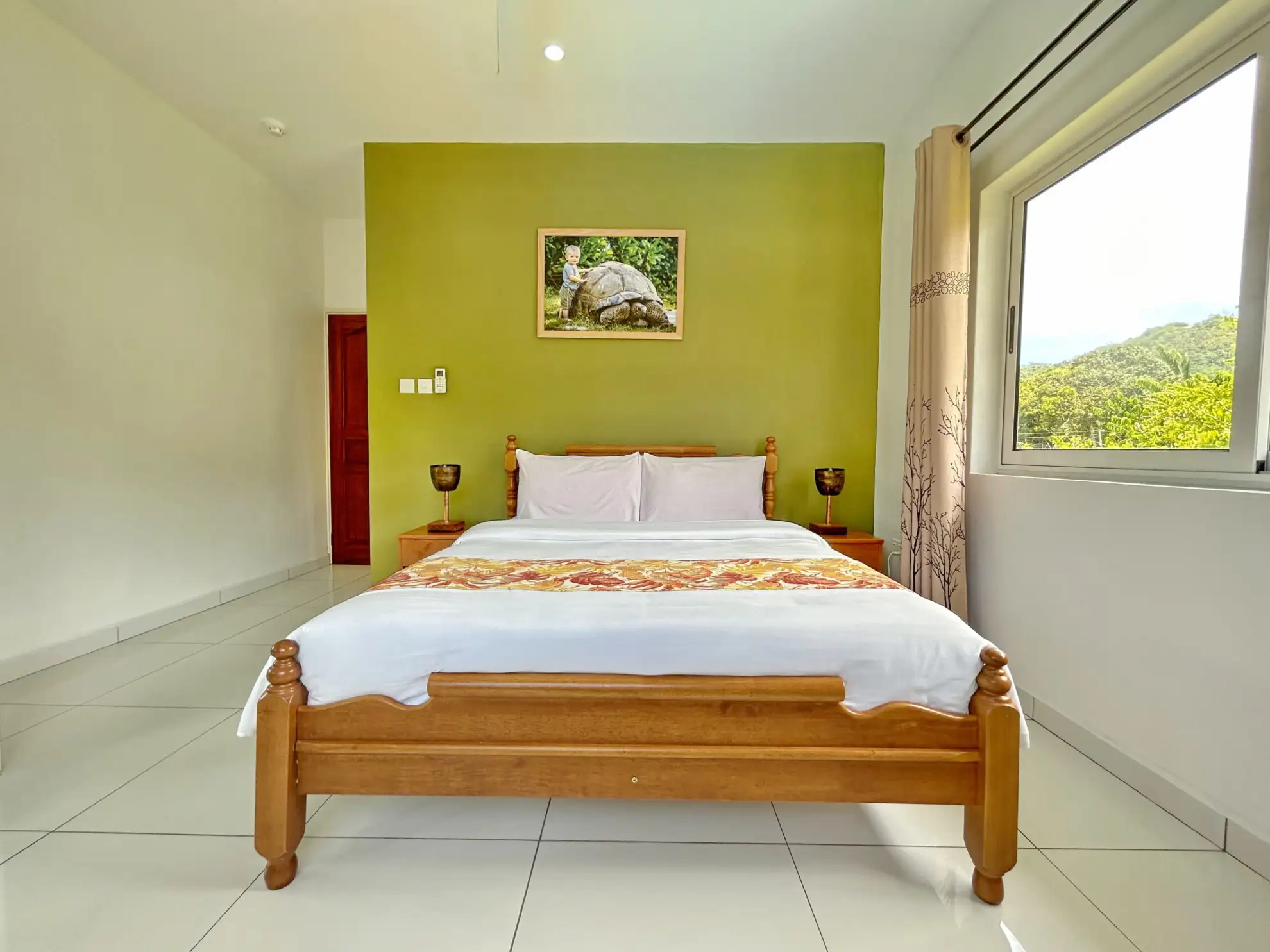 Escape to The Seaboards Apartments, nestled within a vibrant garden adorned with lush flowers and trees, on the breathtaking southwest of Mahe Island.