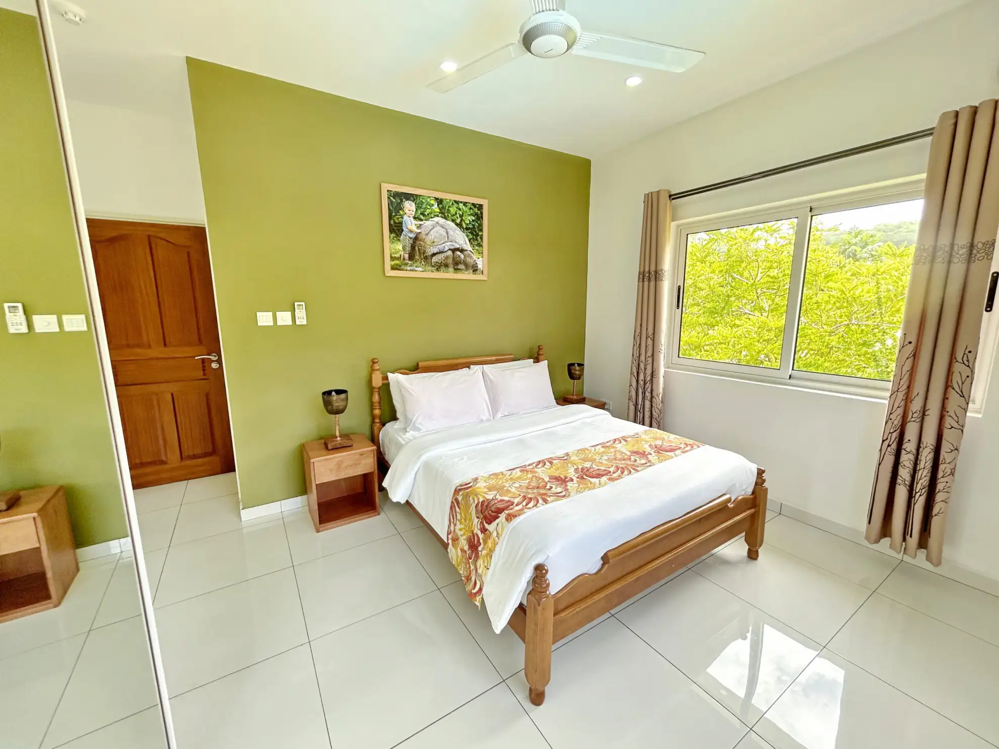Escape to The Seaboards Apartments, nestled within a vibrant garden adorned with lush flowers and trees, on the breathtaking southwest of Mahe Island.