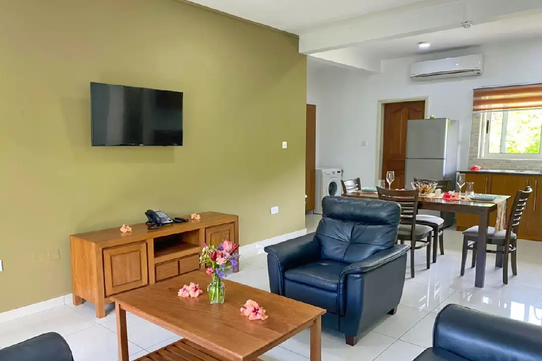 Escape to The Seaboards Apartments, nestled within a vibrant garden adorned with lush flowers and trees, on the breathtaking southwest of Mahe Island.