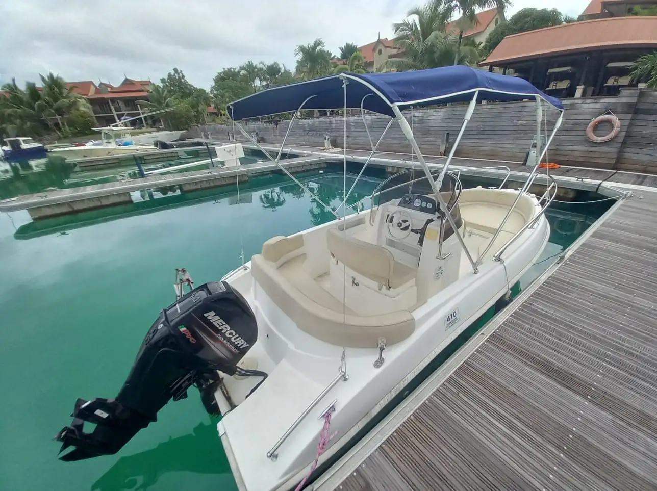 My boat is small and kept on Eden Island. Always within reach and perfect for small trips to the local reefs and Marine park.