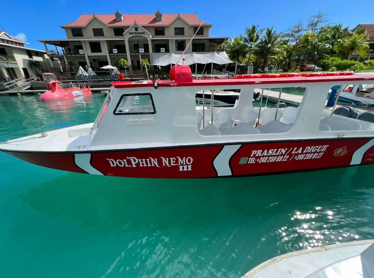 Our bigger boat Dolphin Nemo 3 on Eden Island, jetty, Marina North.