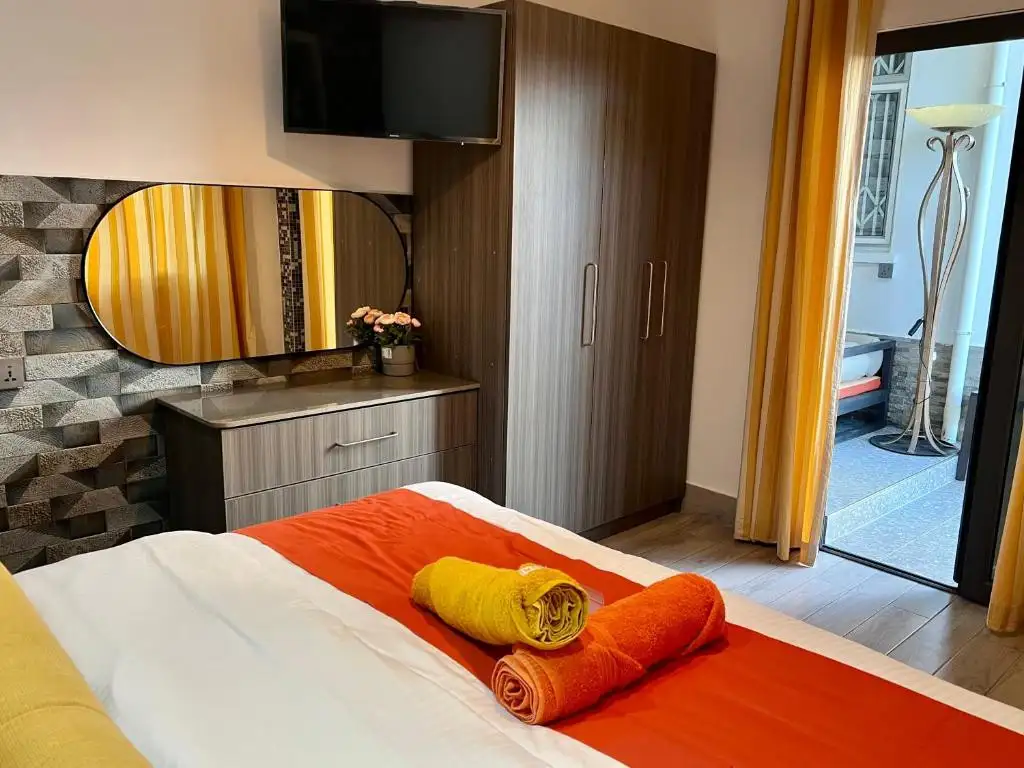 Cozy Bedroom with Cabinets and Flat Screen TV.